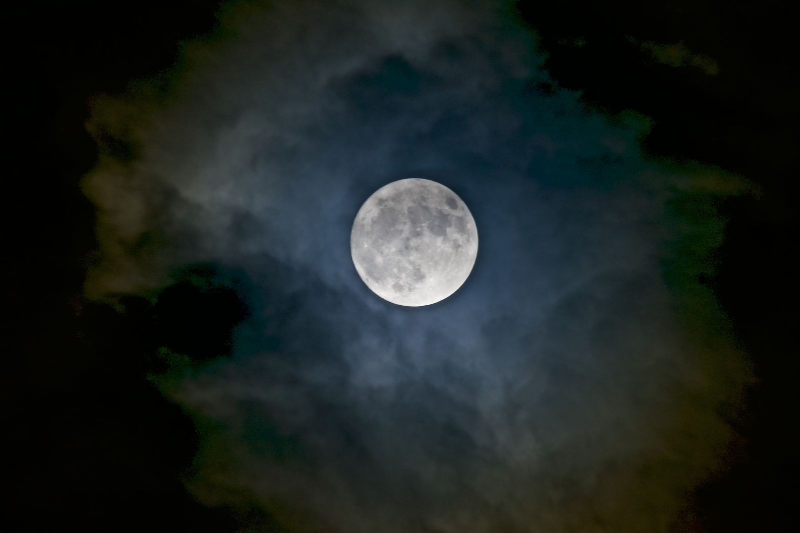 The moon through clouds